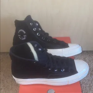 Converse Black and White High-Top Athletic Shoes