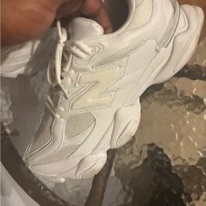 New Balance All-White Athletic Shoes