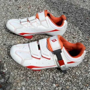 Peloton orange and white bike shoes