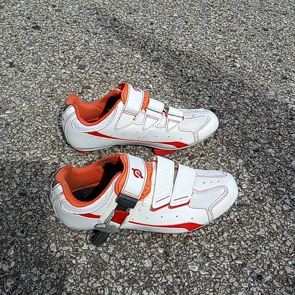 Peloton orange and white bike shoes