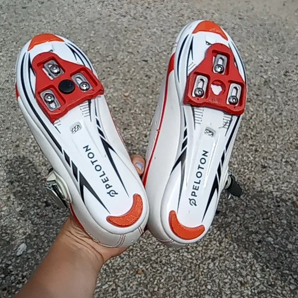 Peloton orange and white bike shoes