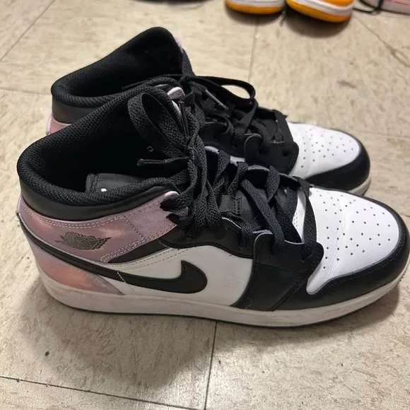 White and purpleish Nike high top shoes