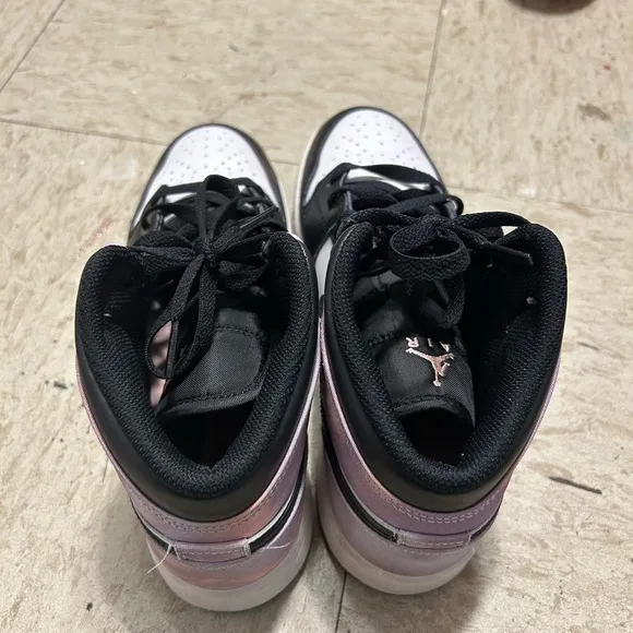 White and purpleish Nike high top shoes