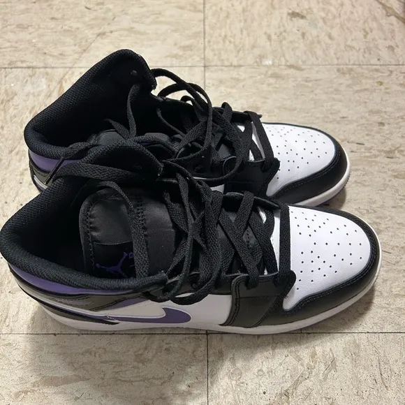 White, black and purple high top shoes