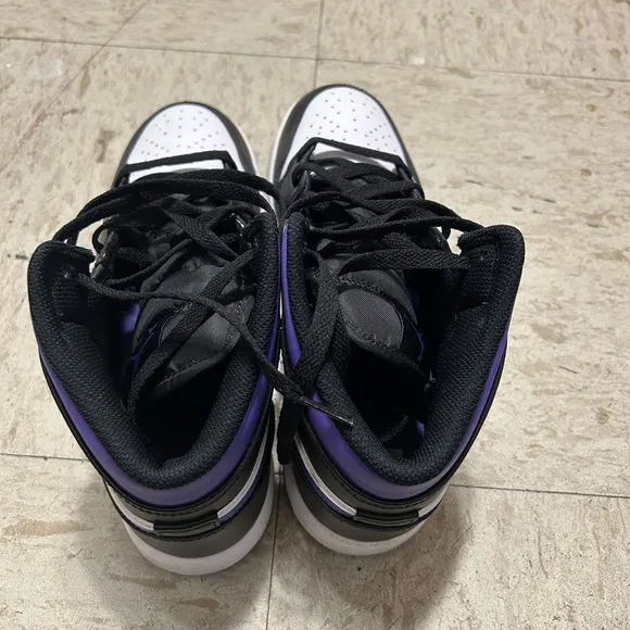 White, black and purple high top shoes